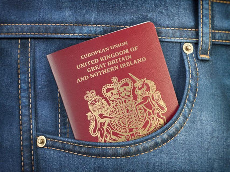 uk-united-kingdom-passport-in-pocket-jeans-reason-should-visit-uk-pandemic-rapid-antigen-test